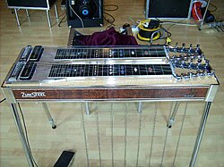 A pedal steel guitar, with the word "Zumsteel" written on its side.