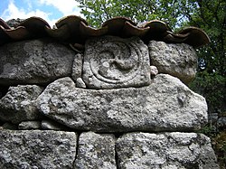 Iron Age Castro culture triskele, reused in a barn, Airavella, Allariz, Galicia, Spain