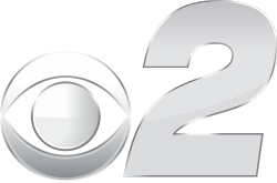 In silver, a CBS eye next to a slightly squished bold italic numeral 2