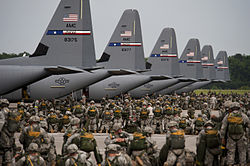Soldiers from the US Army's 82nd Airborne Division prepare for a mass parachute jump from US Air Force C-130J Hercules aircraft during a Joint Operation Access exercise at Pope Field in 2013