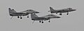 A Sea Harrier flanked by a pair of MiG-29Ks during the retirement of the Sea Harrier.