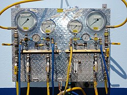 A surface supply panel for four divers showing four pneumofathometer gauges