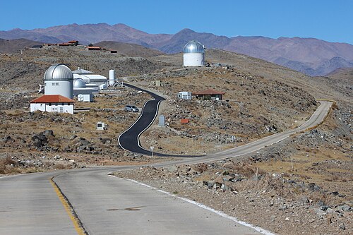 View on the OGLE telescope (in the foreground on the left) and Swope Telescope (in the background above the center)