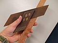 Square with a wooden stock, a steel blade, and brass rivets