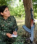 Kurdish Female fighter of the Women's Protection Units (YPJ) wearing MARPAT