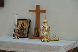 A thurible adjacent to the altar cross of the Marian Chapel of Norrtälje Evangelical-Lutheran Church, part of the Archdiocese of Uppsala