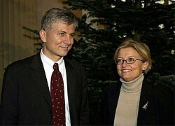 Smiling man and woman standing together