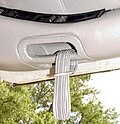 Early-style pull strap on a DeLorean gull-wing door
