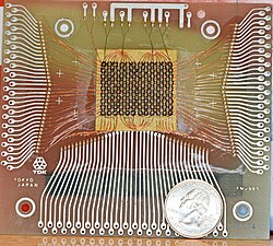 Magnetic-core memory, 18×24 bits, with a US quarter for scale