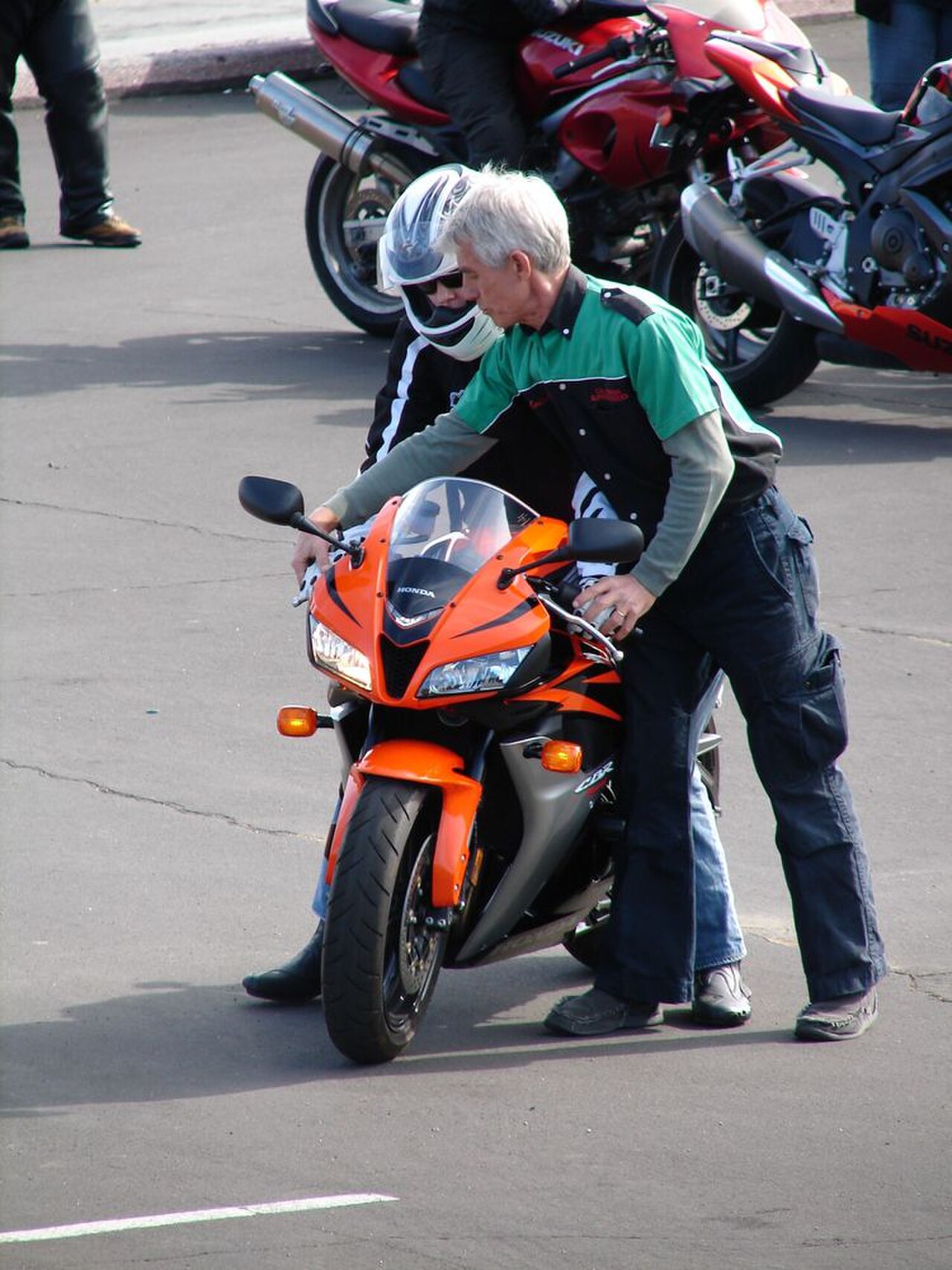 Keith Code at California Superbike School at controls of Honda CBR600RR with rider.jpg