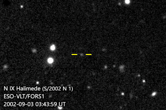 Animation of black-and-white photographs showing Halimede as a pixelated gray dot (between horizontal yellow bars) slowly moving among white stars and galaxies