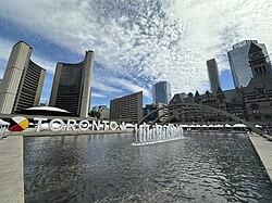 Toronto Sign with Toronto City Hall and Old City Hall in the background
