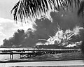 USS Shaw exploding after her forward magazine was detonated by the raging fire
