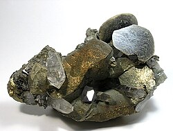 Disc-shaped, brown siderite crystals perched upon chalcopyrites