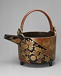 Maki-e Sake Ewer with Chrysanthemums and Paulownia Crests in Alternating Fields. Early 17th century, Azuchi–Momoyama period.