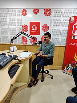 Ramesh talking at a radio show
