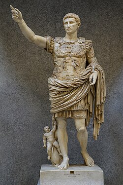 A full-length statue portrait of Augustus. He is depicted wearing armor that shows the story of one of his diplomatic gains as well as a small cherub and dolphin by his right leg.