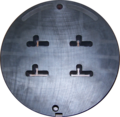 Front side of a four-family die. The die is 228 mm (9.0 in) in diameter.
