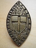 14th-century brass stamp with the shield insignia