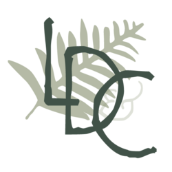 Green letters "LDC" diagonally across a light green fern leaf.