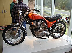 Orange motorcycle in museum