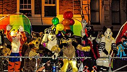 People wearing fursuits on a parade float