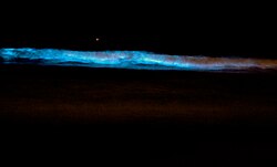 Surf glowing blue in Southern California
