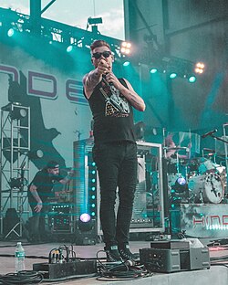 Dutton performing with Hinder in July 2024.