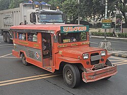 A jeepney with a side door in Quezon City