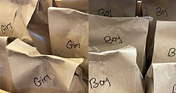 Brown-paper bags labeled "girls" and "boys"