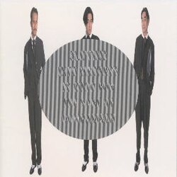 A horizontally compressed photo of the band dressed in suits, with a diffraction grating circle in the middle with the English text "Slipping into madness is good for the sake of comparison".