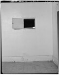 A small passthrough in the wall of the kitchen