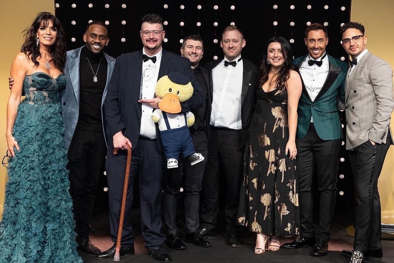 On stage at Royal television society awards NW - Nov 2022.jpg