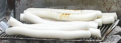 A bunch of long cylindrical tteok, a type of Korean rice flour