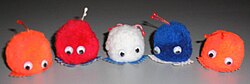 Five weepul toys in various colors