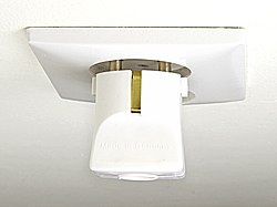 Schuko plug partially inserted in CEE 7/1 non-earthed socket, pins are in contact but exposed. There is no connection for the earthing contact.