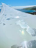 Several patches of speed tape on a Boeing 787 wing