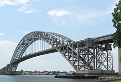 The Bayonne Bridge, a mid-bearing through arch bridge spanning the Kill Van Kull, connecting Bayonne, New Jersey, with Staten Island, New York City