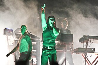 The Prodigy in 2009 performing at Bangalore From left to right: Keith Flint, Maxim, and Liam Howlett