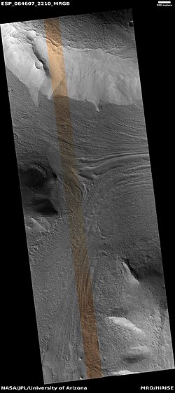 Lineated valley fill in valley, as seen by HiRISE under HiWish program. Linear valley flow is ice covered by debris. Lineated valley fill is generally considered to be and example of a glacier, as it involves the movement of ice.