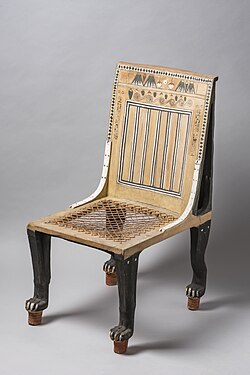 High-backed chair with painted decoration and lion-shaped legs