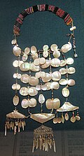 A necklace made of brass, mother-of-pearl and beads