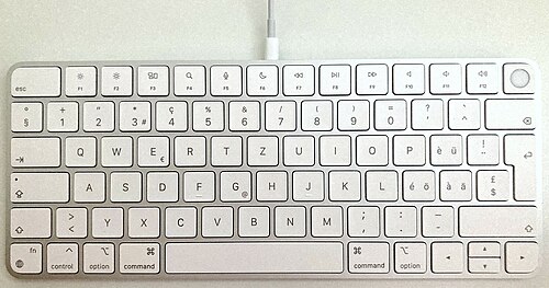 Photo of a Magic Keyboard with Touch ID, swiss keyboard layout, with the Lightning cable connected
