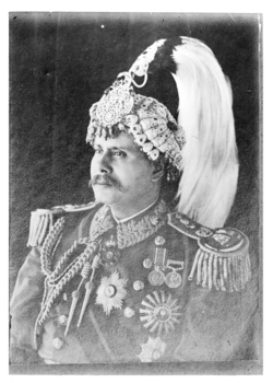 Padma Shumsher Rana wearing an late form of the Rana crown, c. 1945–1948.
