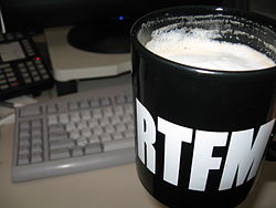 black and white mug with liquid inside