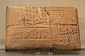 Reverse of a tablet of estimates for harrowing and plowing a field with the workers' wages, authentified by seal impressions of an administrative scribe ("presentation" scene), Umma, reign of Shu-Sin. Musée du Louvre