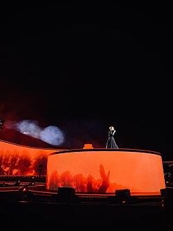 Adele performs on a secondary stage that ascends into the air