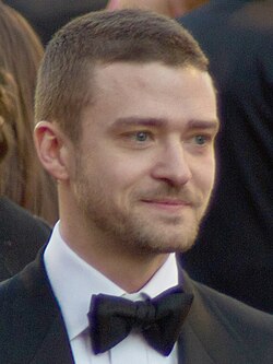 A profile picture of a young blonde man who is looking forward