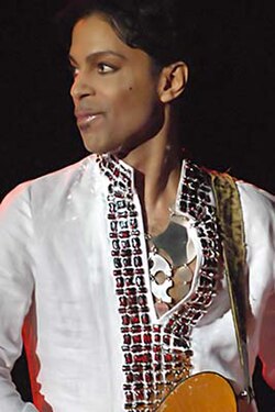 A man looking to the left while performing