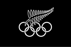 A black flag with a stylized fern in black with white outlines, over the Olympic Rings in white.